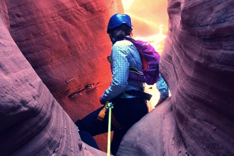 a person riding a skate board in a canyon