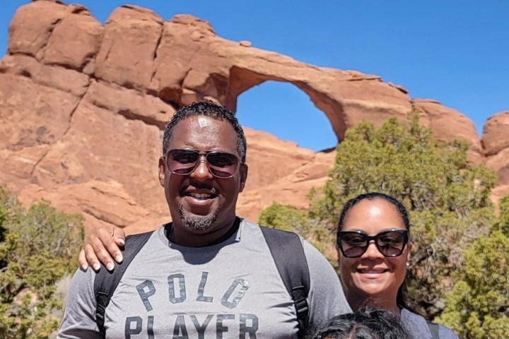 a man standing in front of a mountain